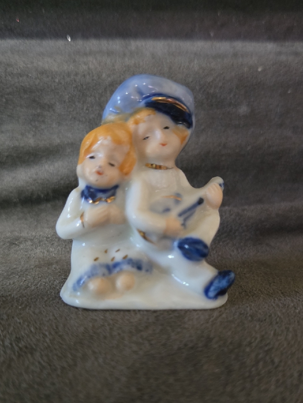 vintage Japanese orcelain Figurine of a boy playing a guitar for a girl